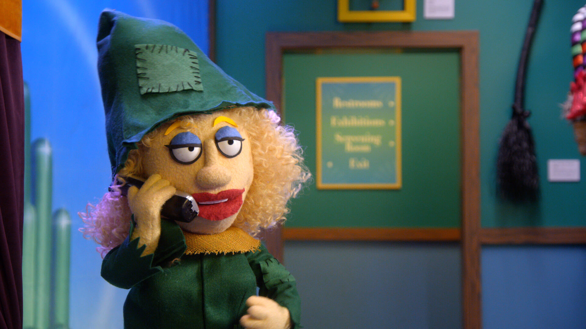 A female puppet dressed as a witch aswers a prank call from Thomas Lennon in a scene from Crank Yankers edited by Todd Bishop