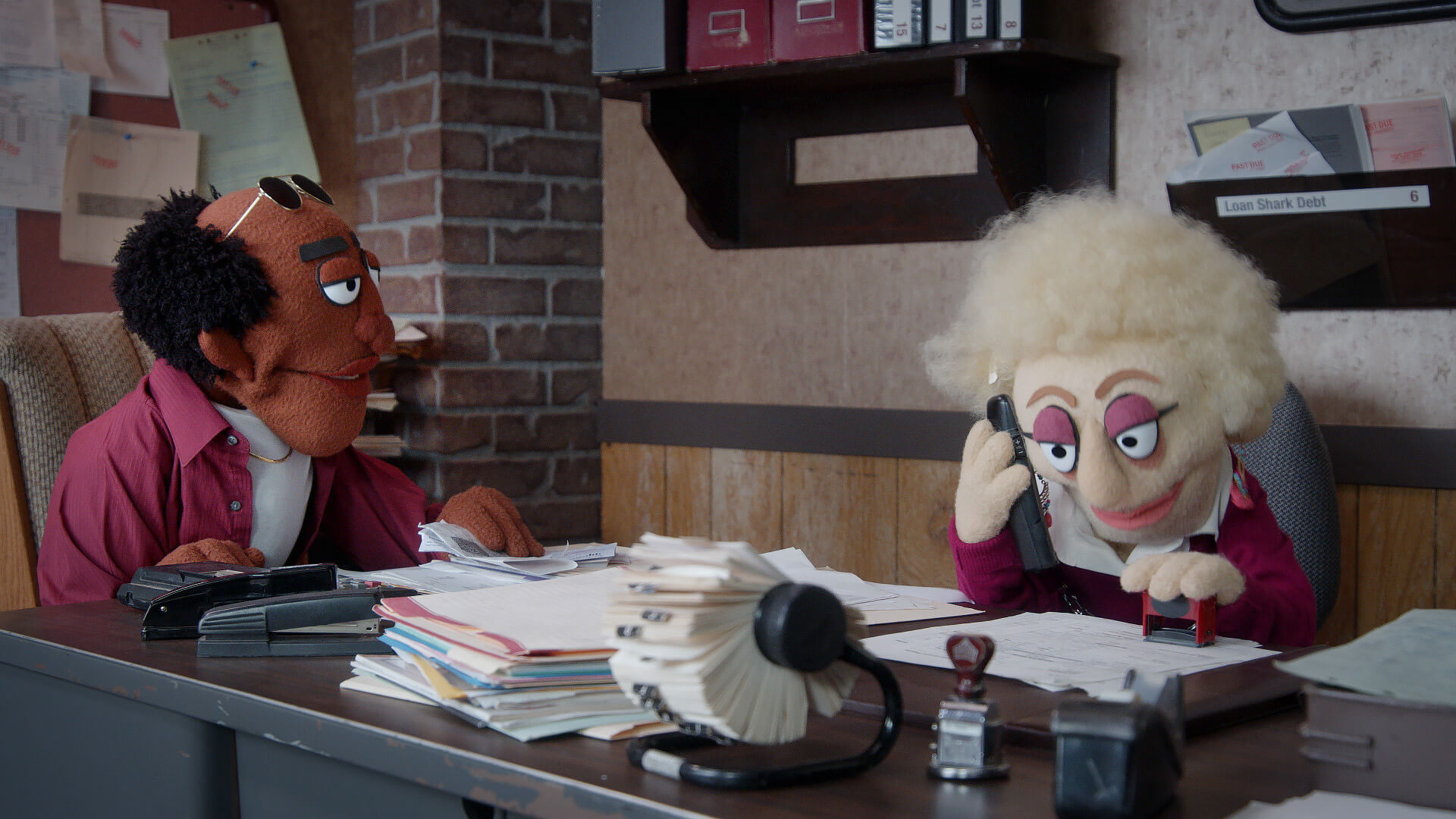 A female debt collector answers a prank call in a scene directed by Todd Bishop for Comedy Central's Crank Yankers