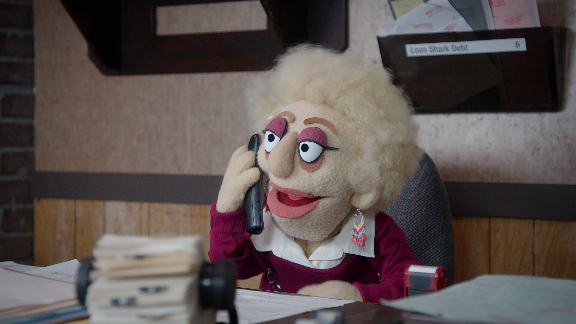 Female debt collector talks to Bobby Fletcher from a scene from Crank Yankers directed by Todd Bishop