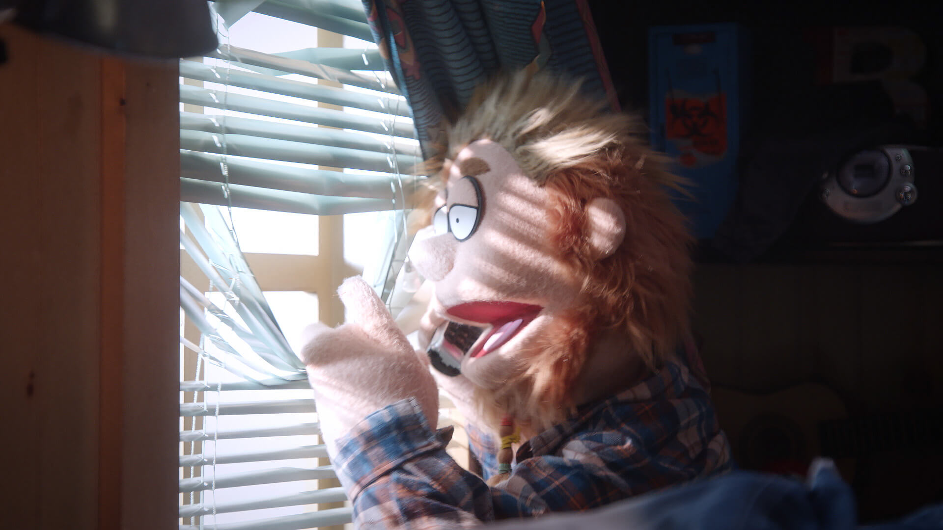 Bobby Fletcher looks out the window on Comedy Central's Crank Yankers in a call directed by Todd Bishop