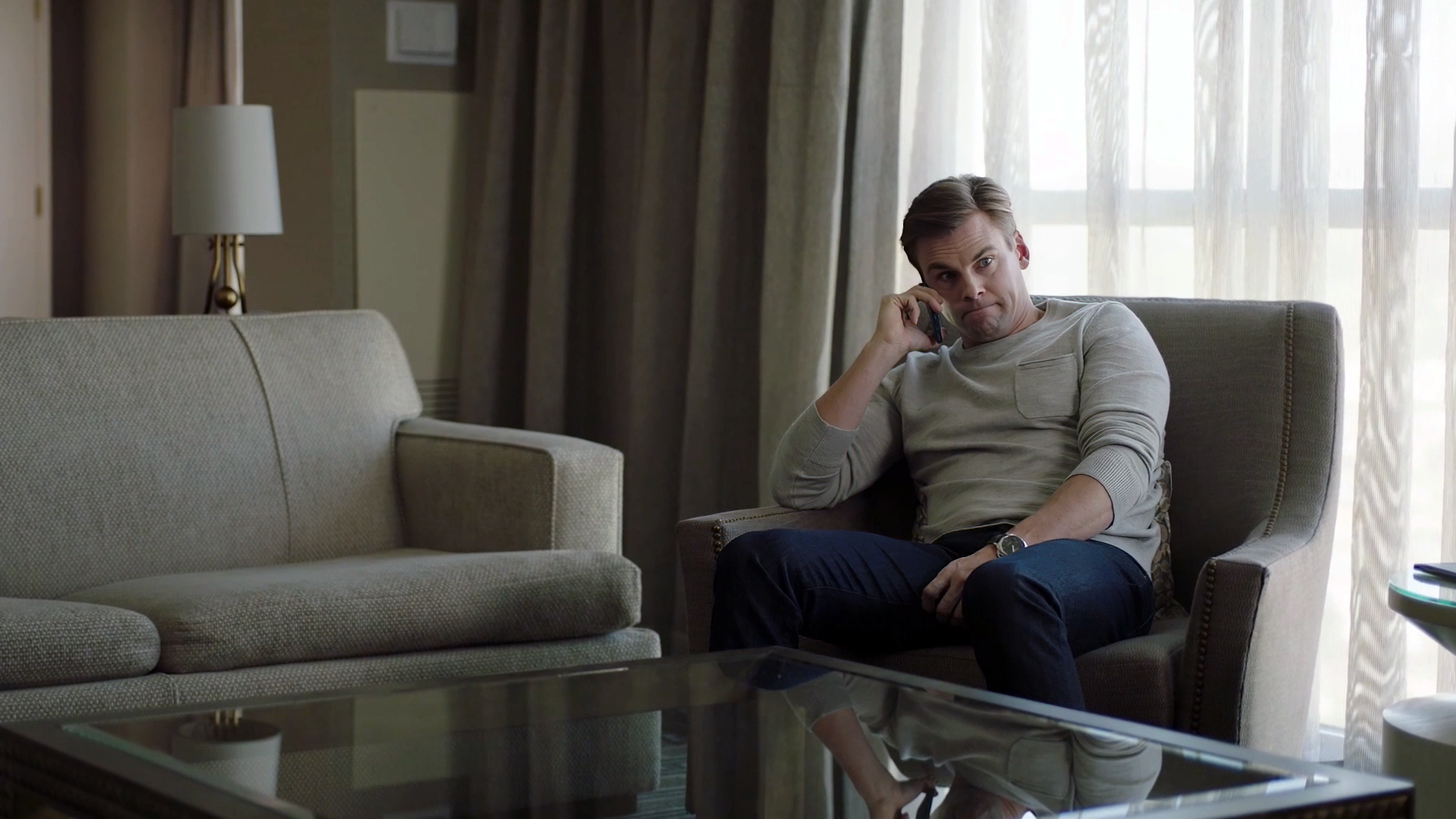 Tommy Dewey takes a phone call from his overbearing mother in this image from a scene edited by Todd Bishop for season two of Now We're Talking.